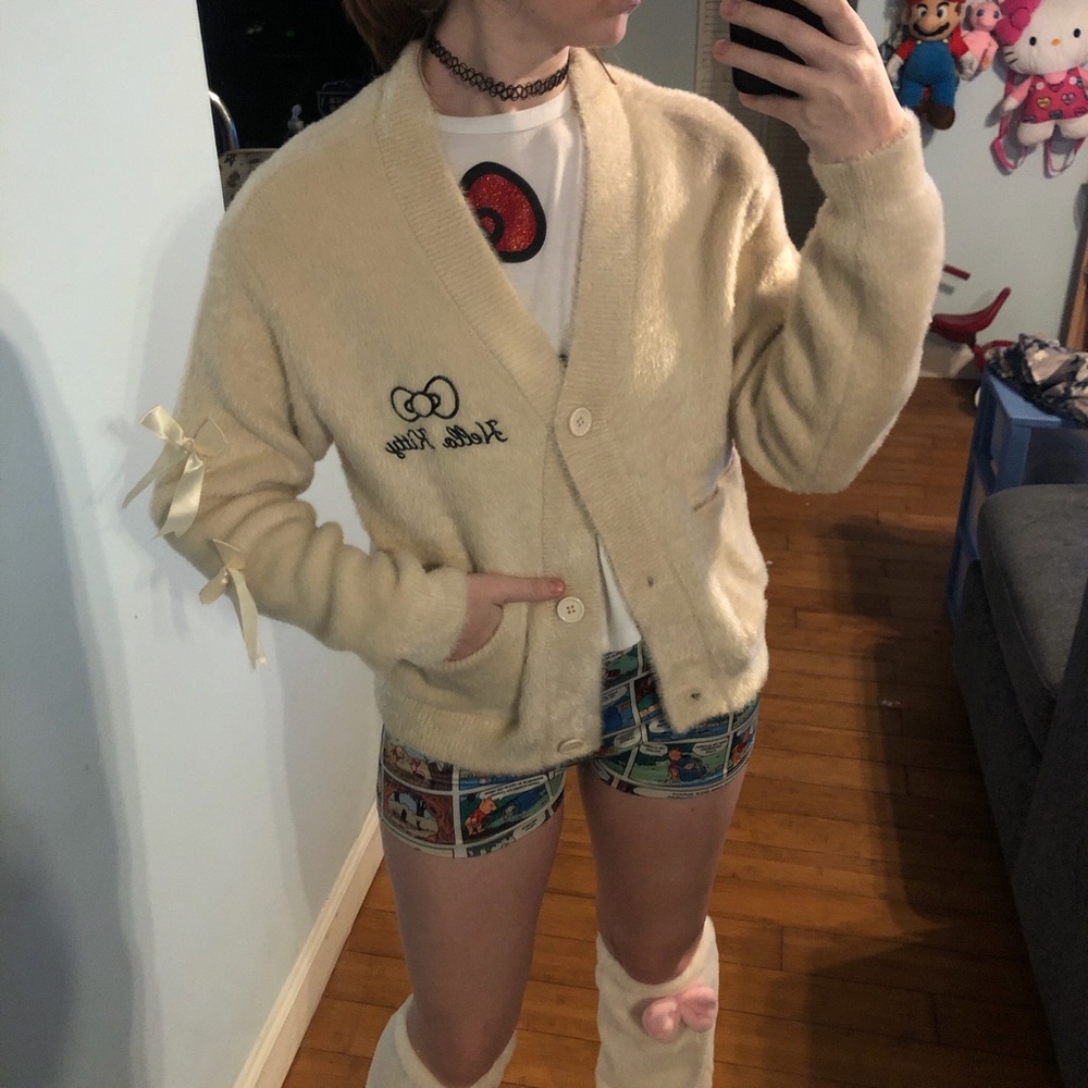 Hello Kitty cream cardigan with bow detail. Size S